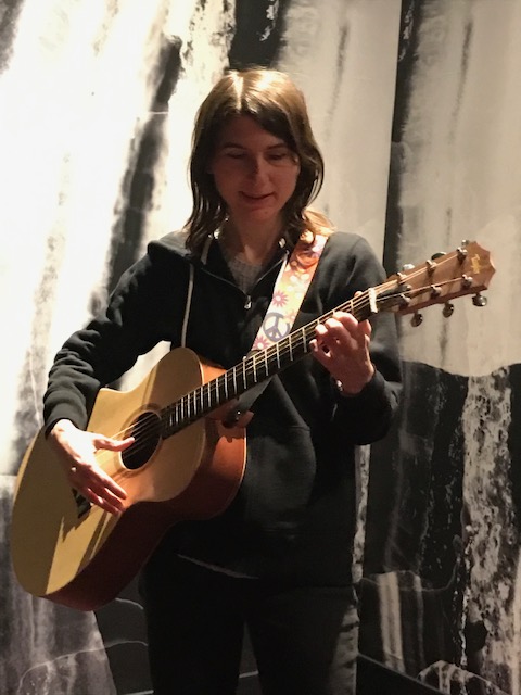 Tara Trent Music_3_22_2023_standing promo shot_close up_looking down with guitar_great pic_warm up at Virgin Hotels LV